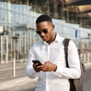 business traveller overseas on mobile